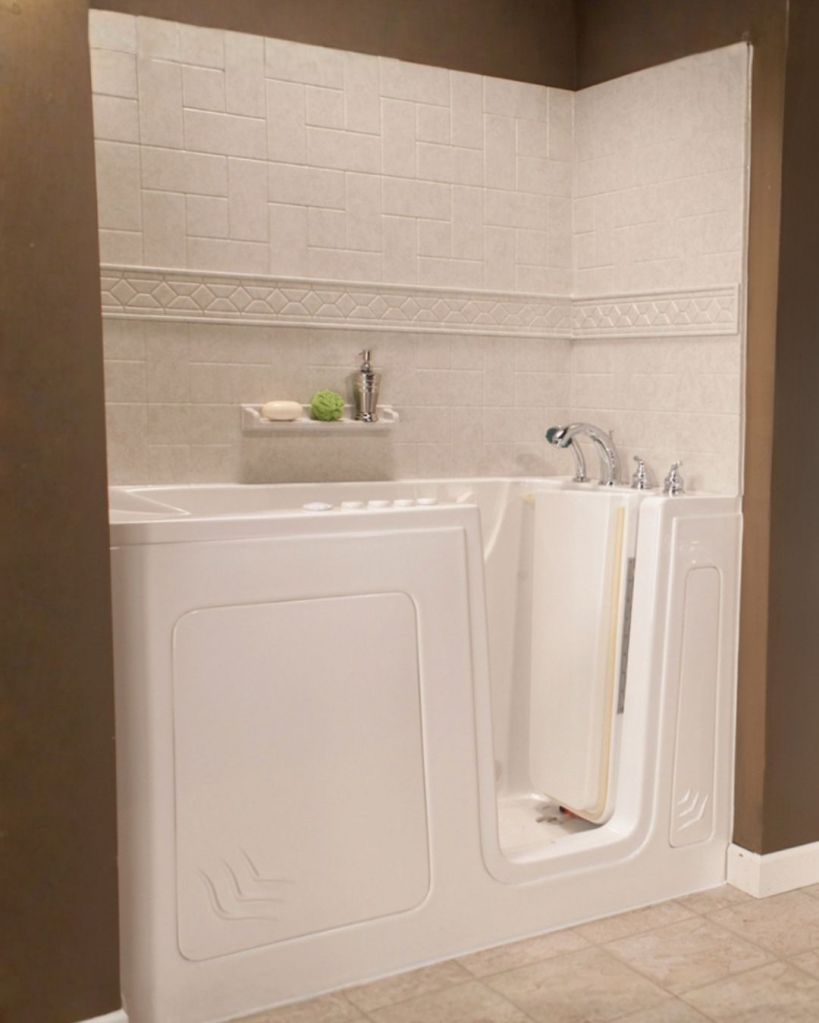 Walk-in soaking tub with easy-entry door, built-in seating, and accessible bathroom safety features designed for senior homeowners by The Bath Authority.