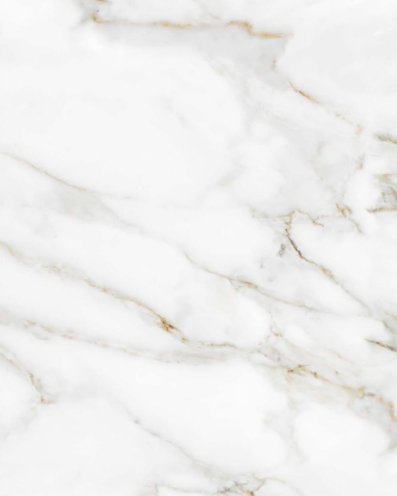 White engineered stone shower surround or vanity countertop with soft gray and gold marble veining from The Bath Authority, offering elegant style and low-maintenance performance.