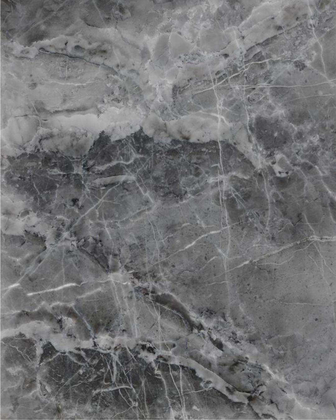 Gray marble-inspired engineered stone shower wall panel or vanity countertop with rich natural veining, featured in a custom bathroom remodel by The Bath Authority.