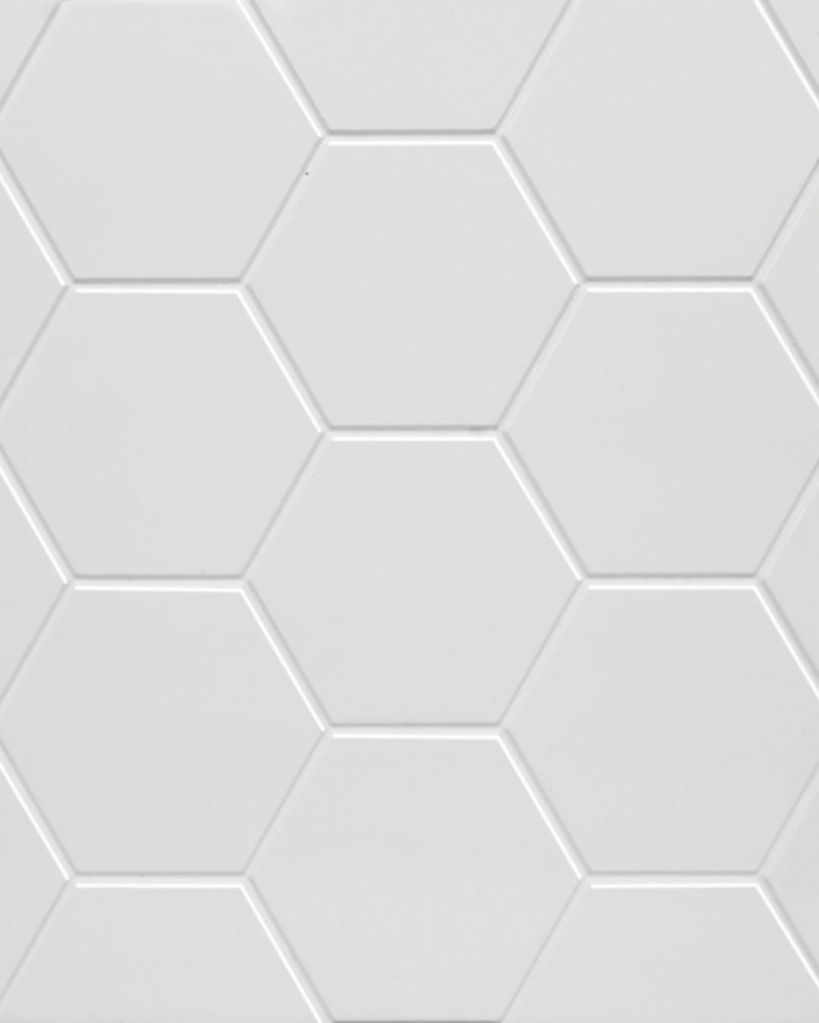 White hexagon-pattern engineered stone shower surround or vanity countertop from The Bath Authority, delivering a modern tile appearance without grout upkeep.