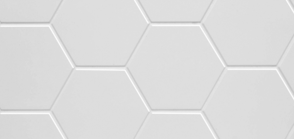 A zoomed-in image of the engineered stone, White Hexagon, available in bathroom remodels by The Bath Authority.